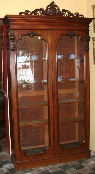 victorian glazed bookcase with carved cornice