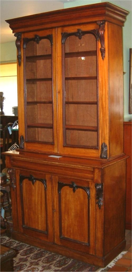victorian walnut library bookcase with darker contrasting carved decoration