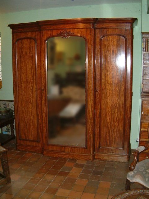 superb victorian figured mahogany triple wardrobe with linen slides drawers