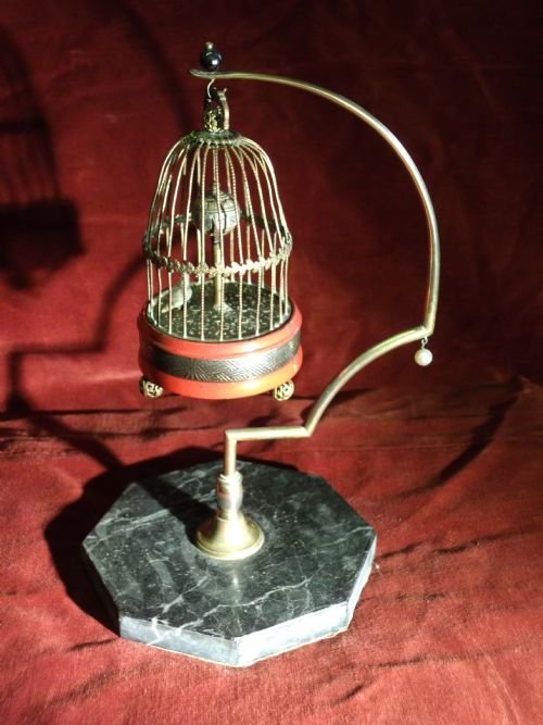 1920s bird in a gilded cage clockon a marble base