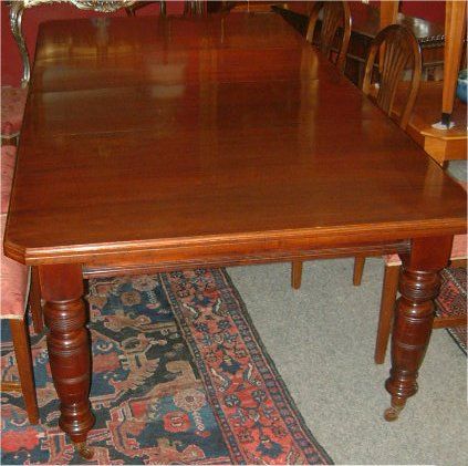 edwardian walnut extending dining table with 2 leaves