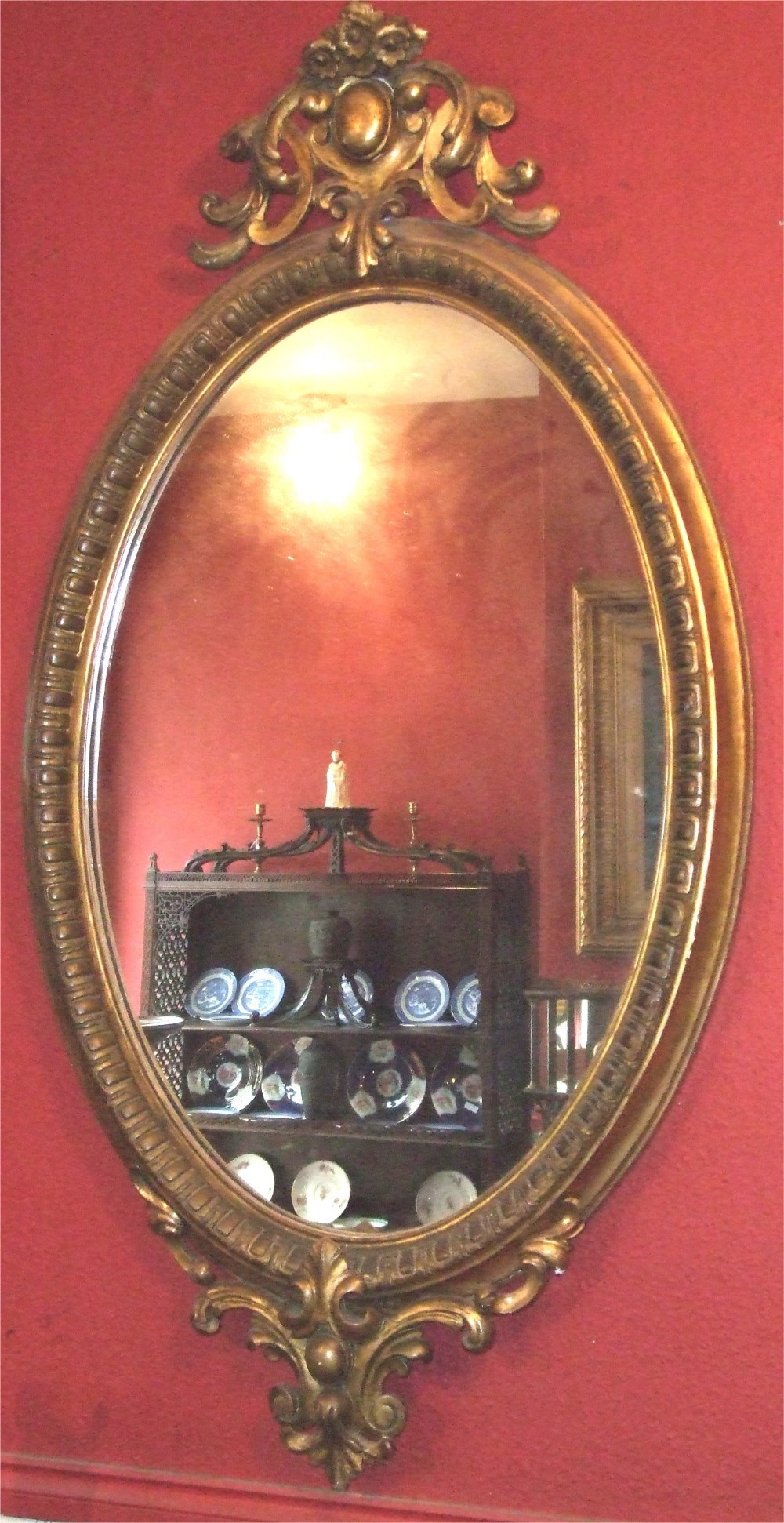 19thc carved giltwood oval mirror