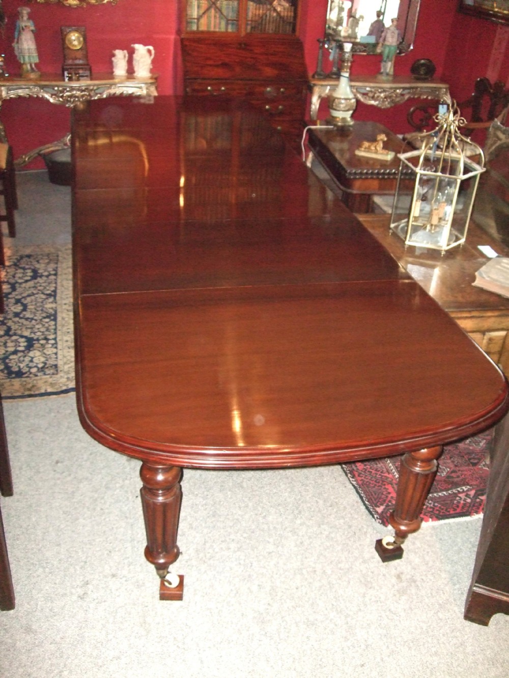 19th century mahogany pull out dining table with 4 leaves