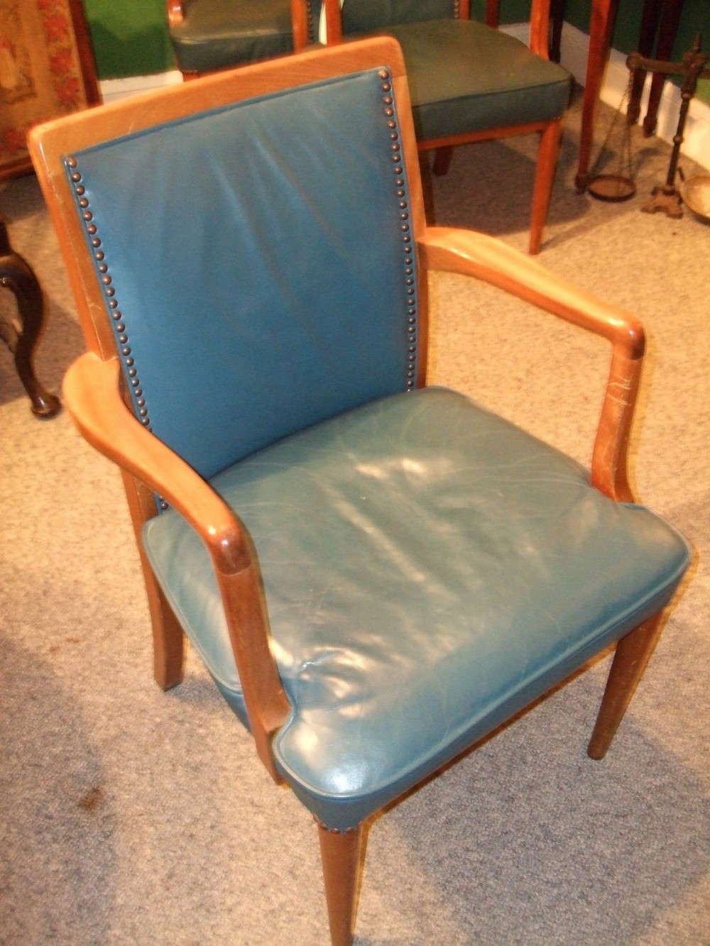 set of 12 art deco dining chairs all with arms upholstered in blue leather