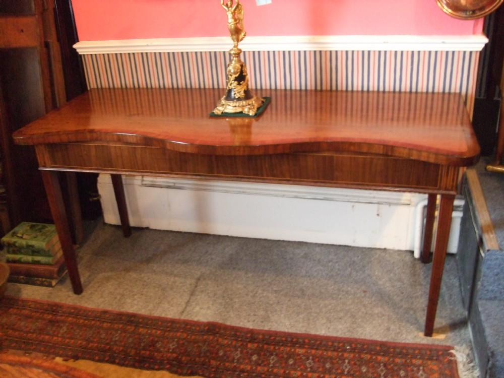 a good 18thc mahogany inlaid serpentine serving table possibly irish