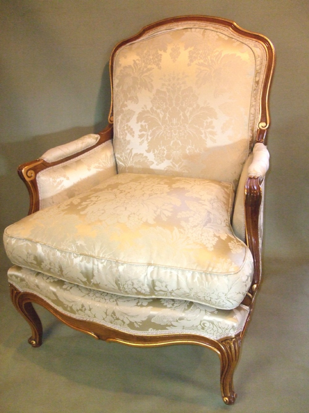 good pair of 20thc parcel giltwood french style arm chairs