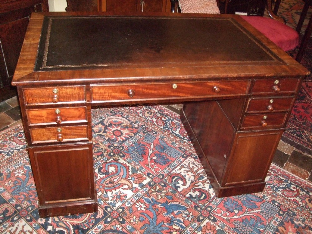 unusual 19thc mahogany partners desk of small proportions