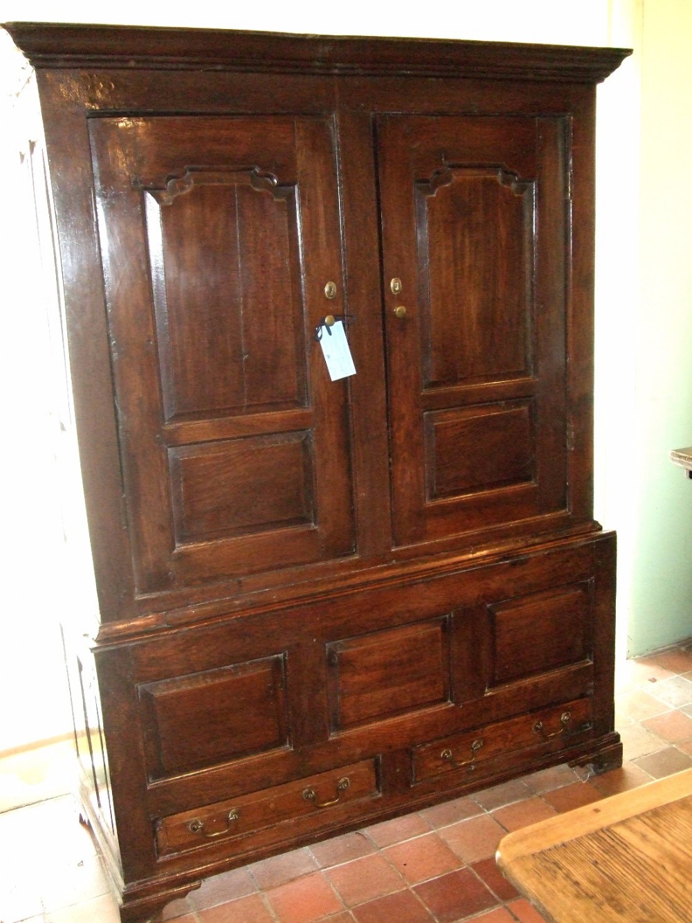 18th century oak press or livery cupboard with two small drawers
