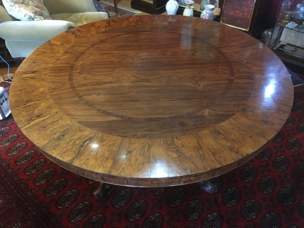 19th century rosewood tilt top pedestal dining table