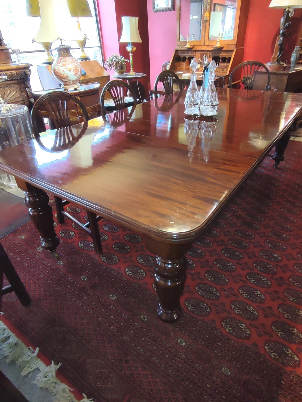 19thc mahogany wind out extending dining table with 3 original leaves