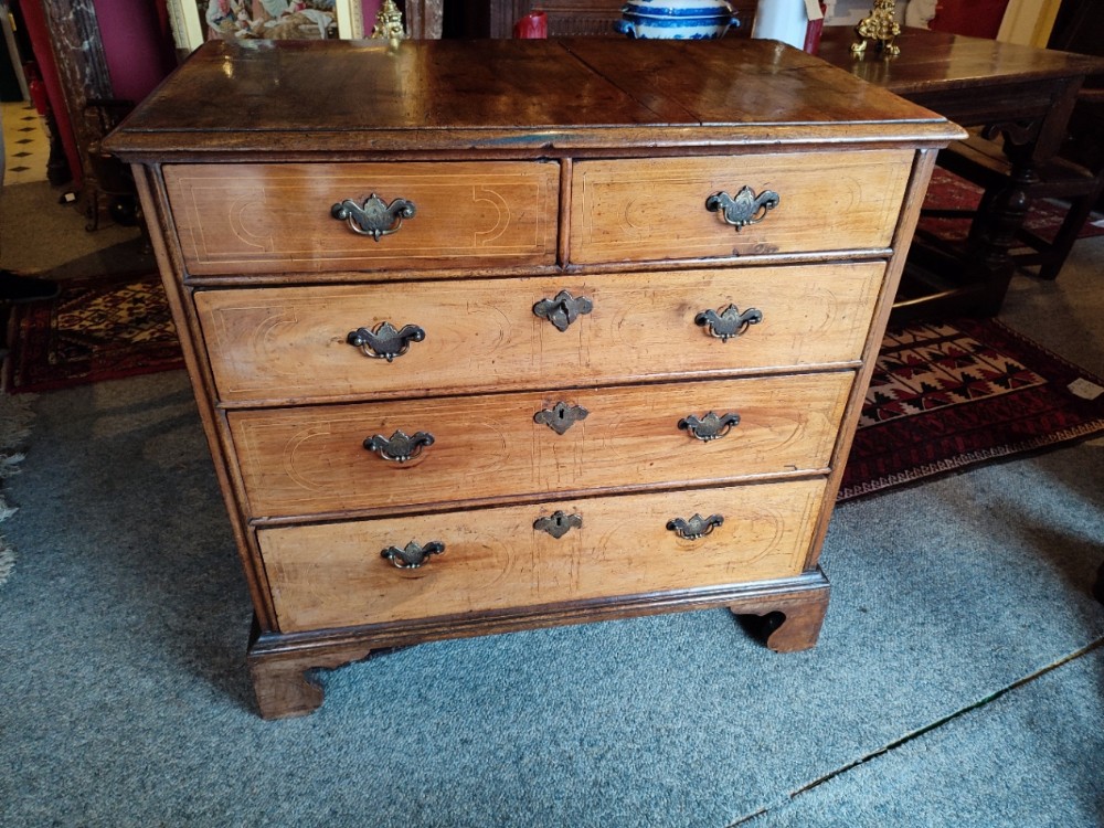 queen anne period walnut inlaid chest of drawers with brass handles