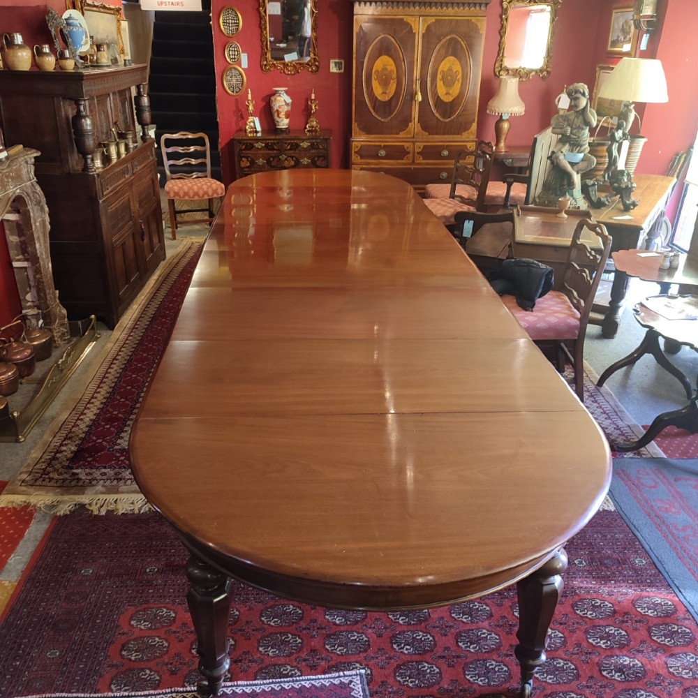superb early 19th c extending imperial mahogany dining table and leaf storage sideboard