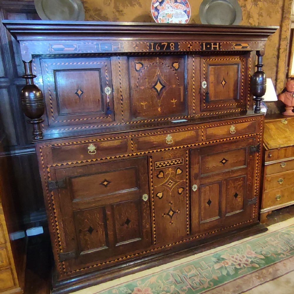 fine inlaid oak court cupboard dated 1678