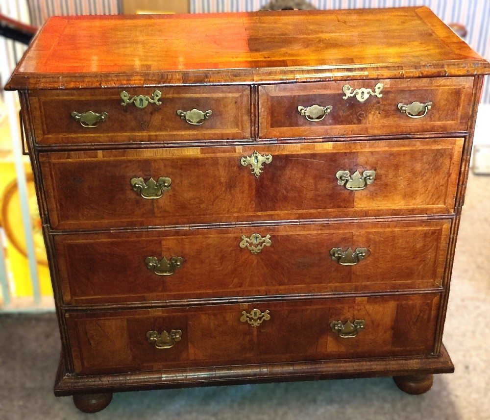 early 18th century walnut chest of drawers made in two sections