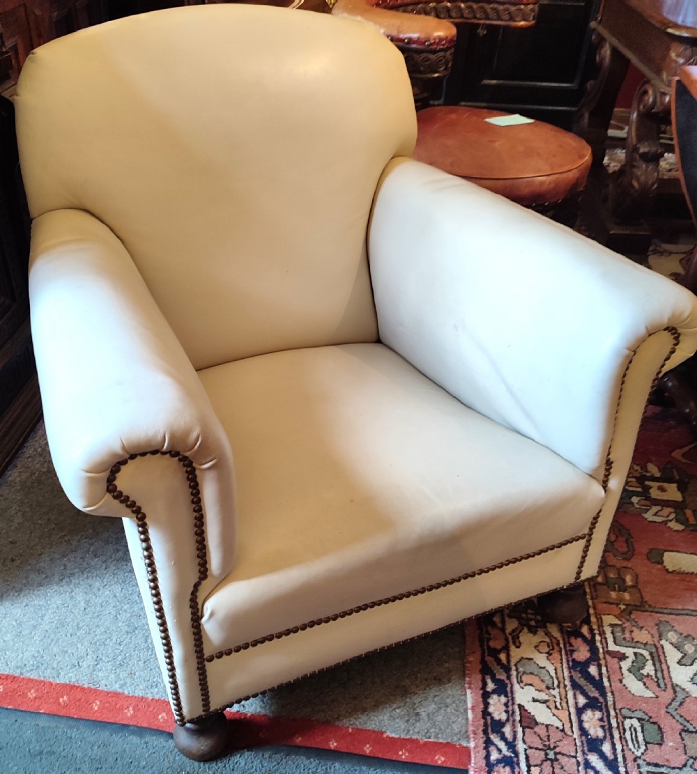 edwardian leather club chair on turned feet