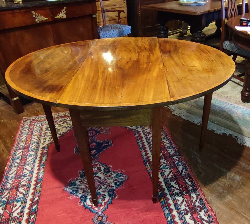 18thc irish mahogany drop leaf dining table with crossbanding